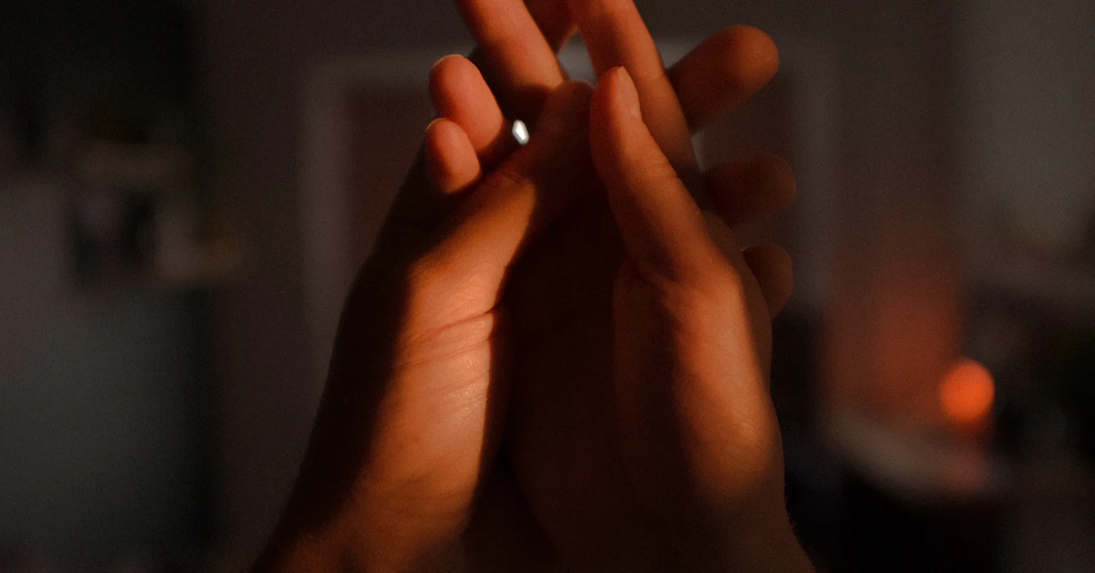 persons hand forming heart