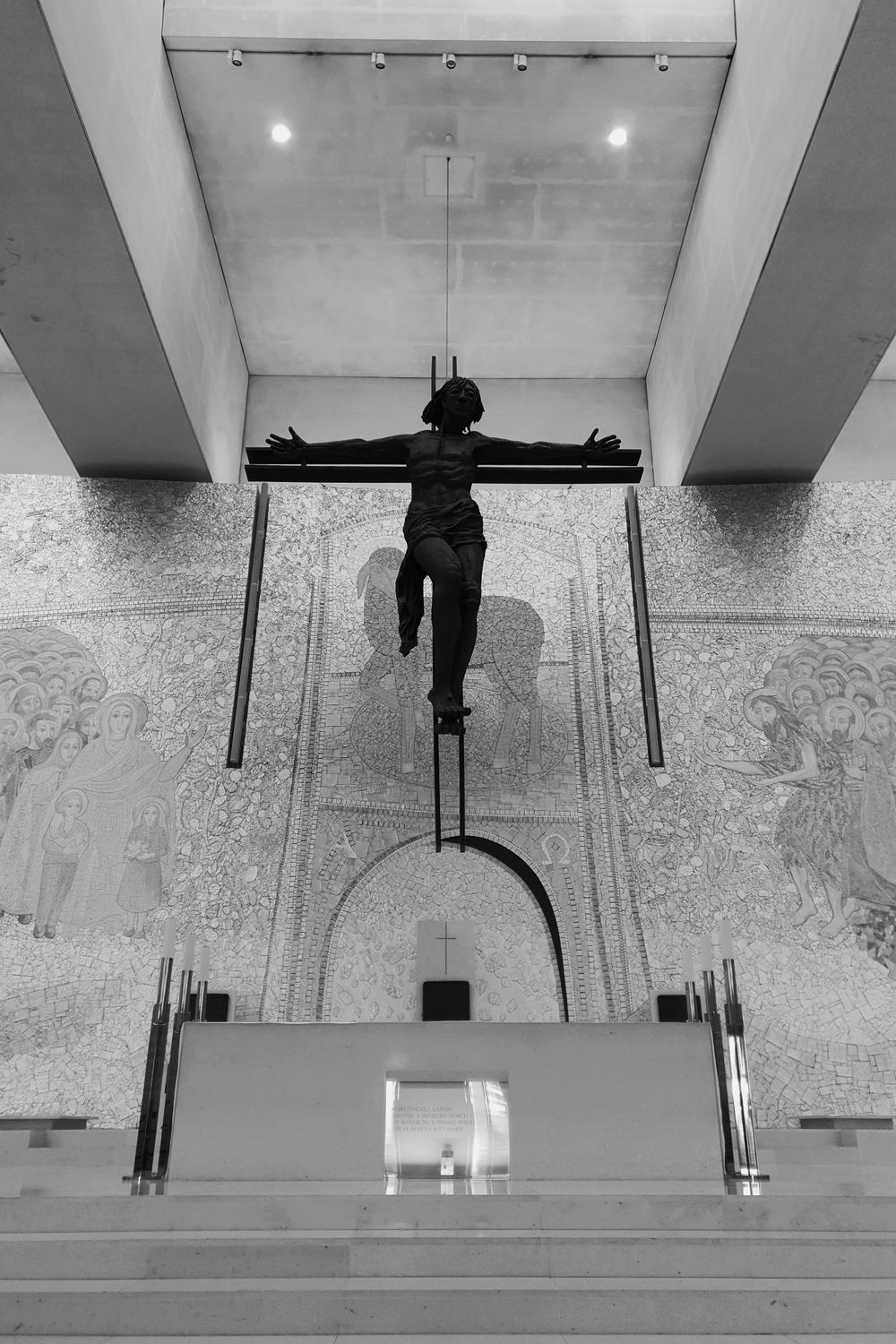 Grayscale image of the Cristo Crucifix at the Basilica of the Holy Trinity in Fátima, Portugal.